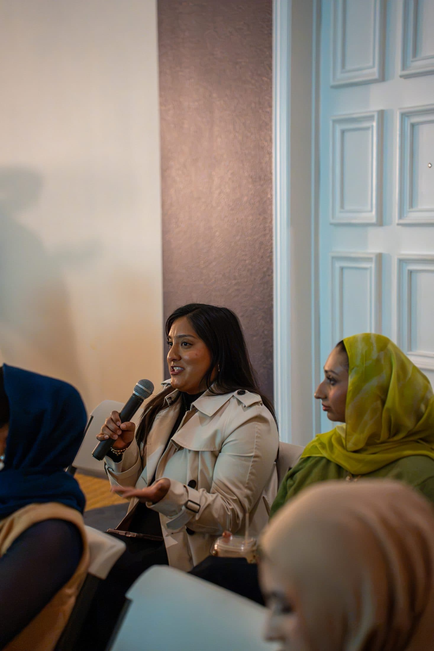 A question from the floor, mic in hand