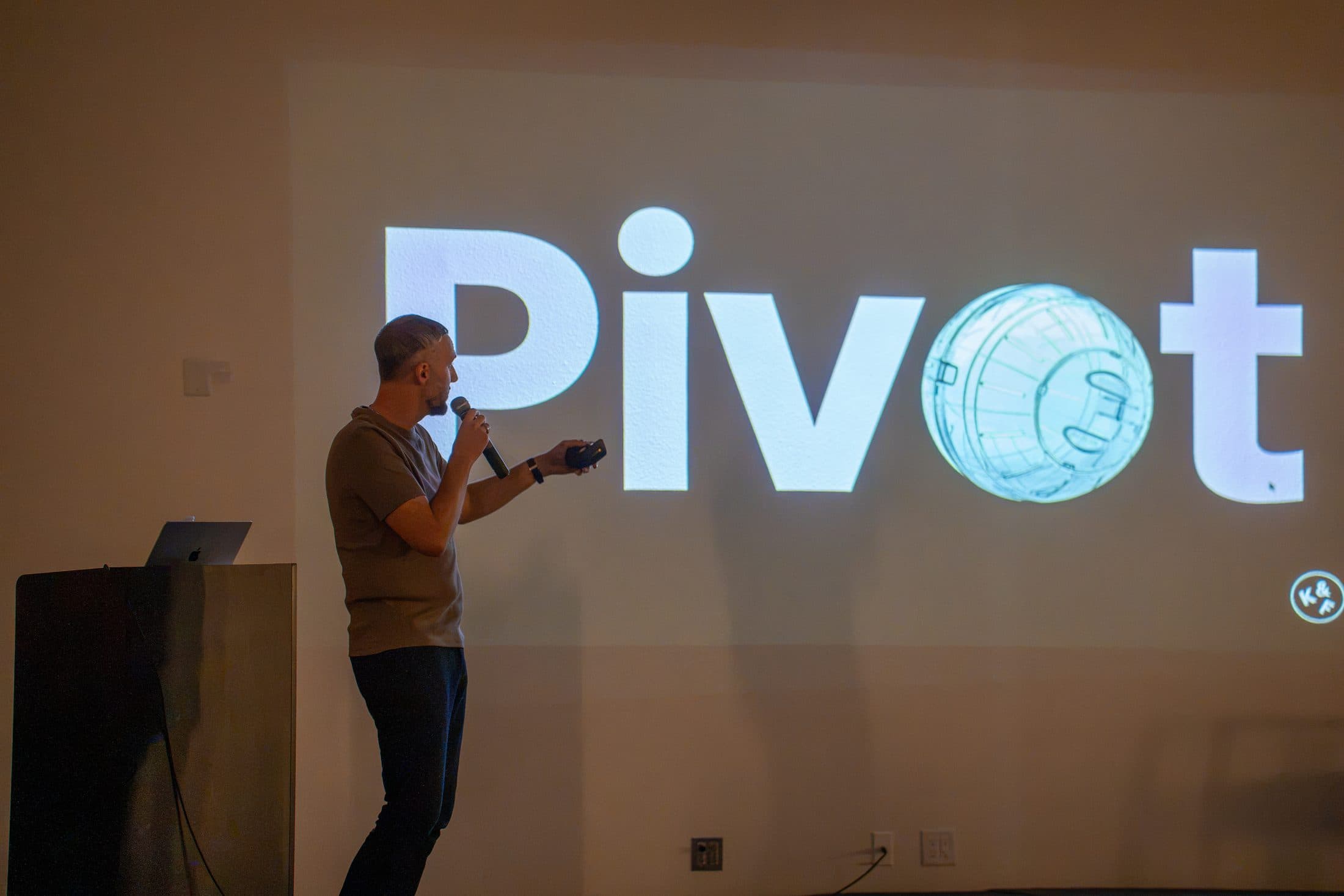 Tarik Nally on stage in front of his Pivot slide